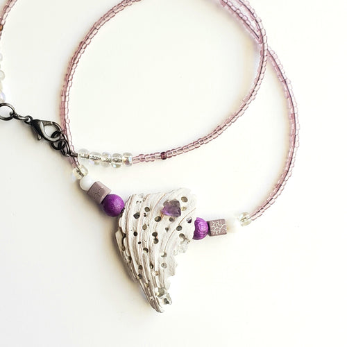 Amethyst crystal on shell with mixed purple and white glass and stones necklace